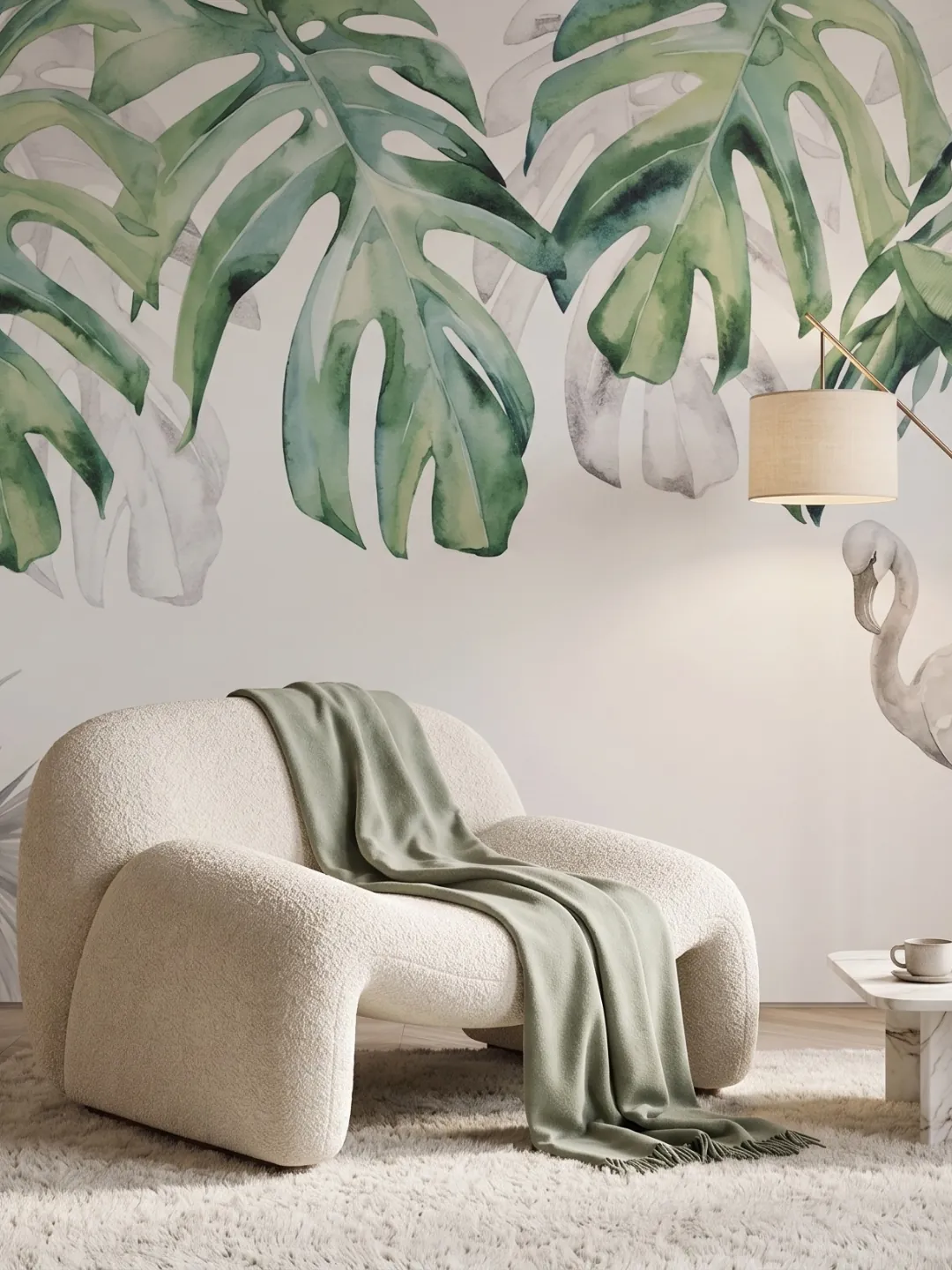 Mural de hojas de monstera verdes en una sala clara